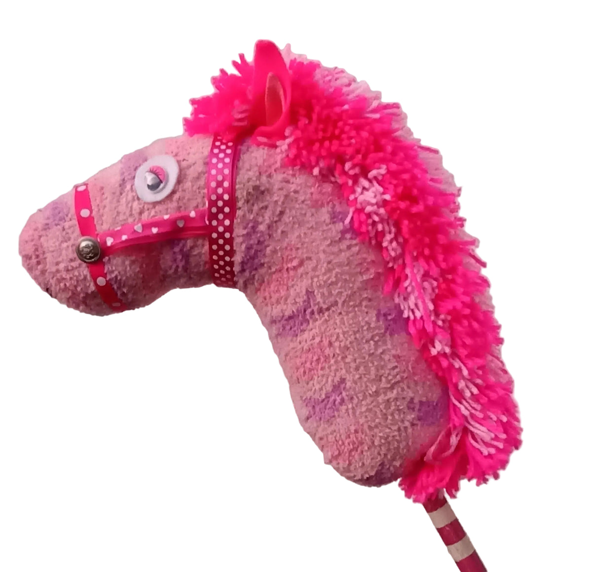 A pink fuzzy sock horse toy with a bright hot pink faux fur mane, pink polka-dot halter, and a striped stick.